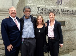 Photojournalist Daniel Morel (2nd. from left) with his legal team (L - R): lead attorney Joseph Baio, Morel, and attorneys Phyllis Galembo and Emma James. Morel was awarded $1.22 million in the willful copyright infringement case Morel v. AFP and Getty Images.  © Jeremy Nicholl