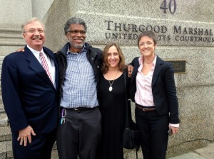 Photojournalist Daniel Morel (2nd. from left) with his legal team (L - R): lead attorney Joseph Baio, Morel, and attorneys Phyllis Galembo and Emma James. Morel was awarded $1.22 million in the willful copyright infringement case Morel v. AFP and Getty Images.  © Jeremy Nicholl
