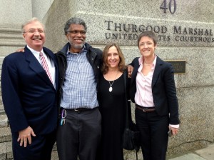 Photojournalist Daniel Morel (2nd. from left) with his legal team (L - R): lead attorney Joseph Baio, Morel, and attorneys Phyllis Galembo and Emma James. Morel was awarded $1.22 million in the willful copyright infringement case Morel v. AFP and Getty Images. © Jeremy Nicholl